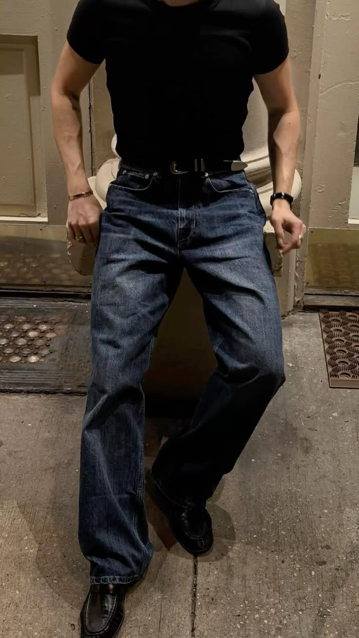 Straight blue denim styled with a black tee and leather shoes