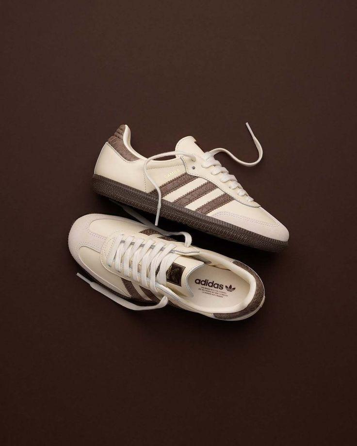Cream sneakers on a brown studio background